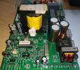 Faulty charger no output. Caused by three capacitors black & white on the left side of image.